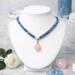 Bead & Braid Collective handmade blue Kumihimo necklace on white bust with rose quartz pendant, artisan beaded jewelry